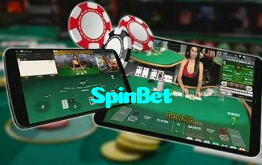 SpinBet casino presented on mobile device in Pakistan with slots and live games